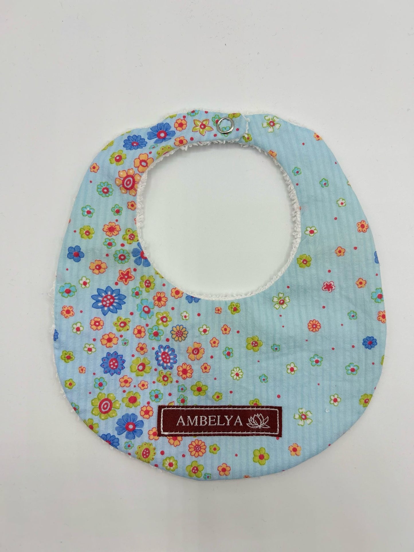 photo d'un bavoir bleu clair Ambelya pour enfant